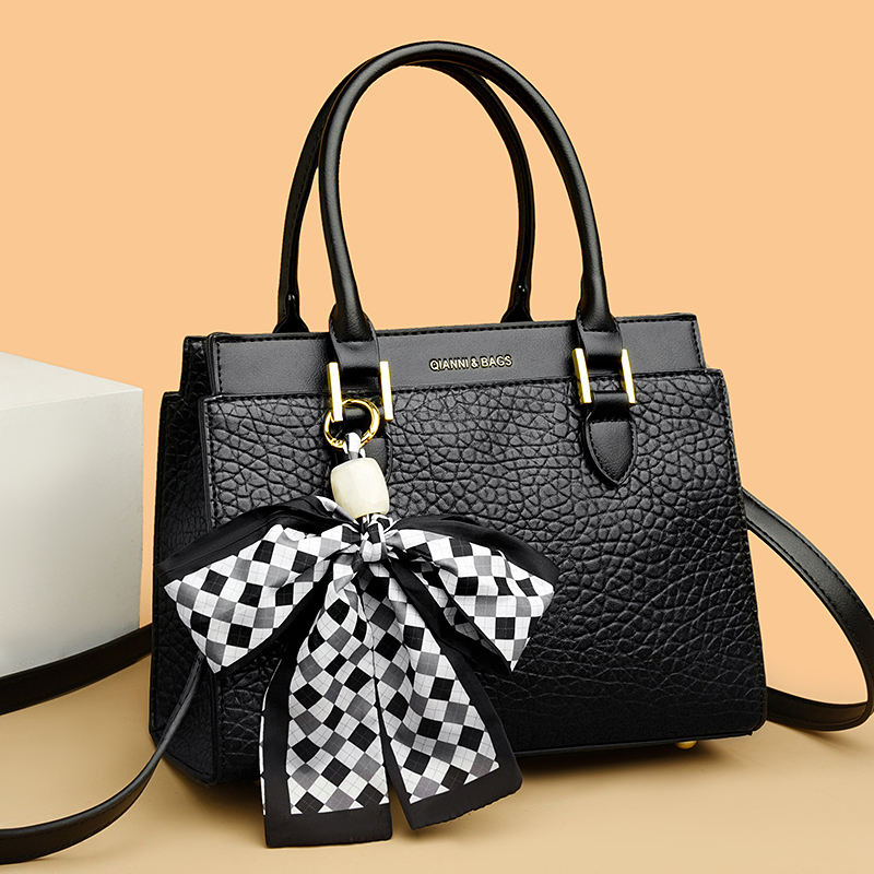 Black bow-accent handbag · BG-MS-2111205335