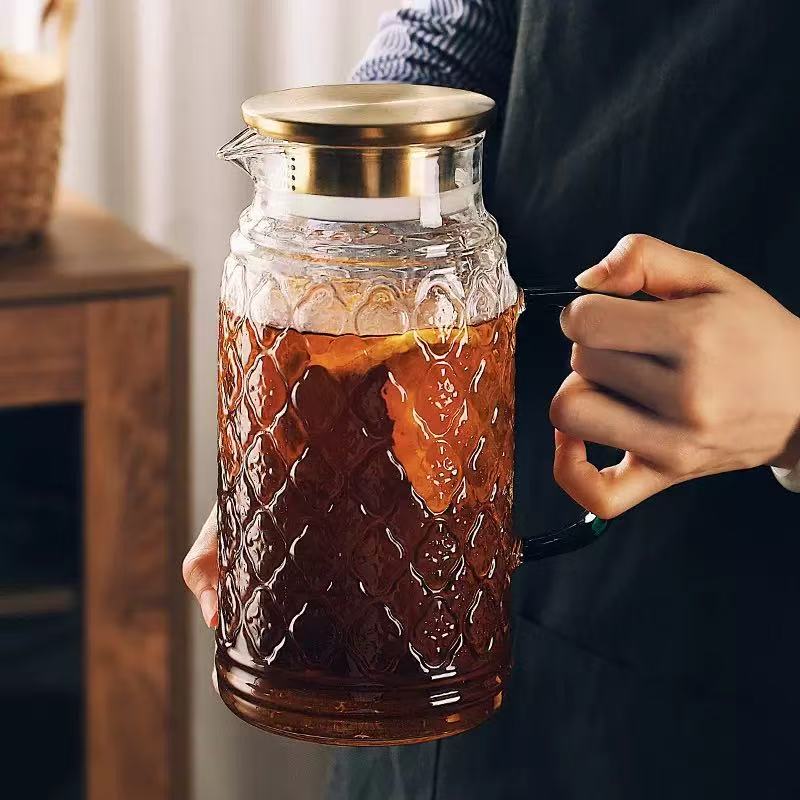 Glass pitcher with interlocking floral relief · HJ-034