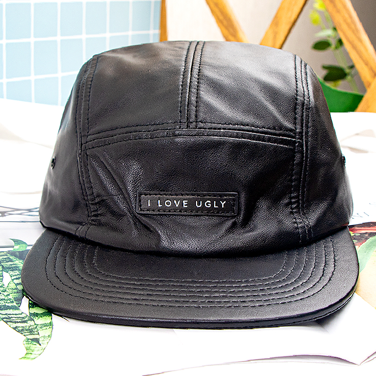 Panelled leather-look camp cap with visible stitching · FS-101