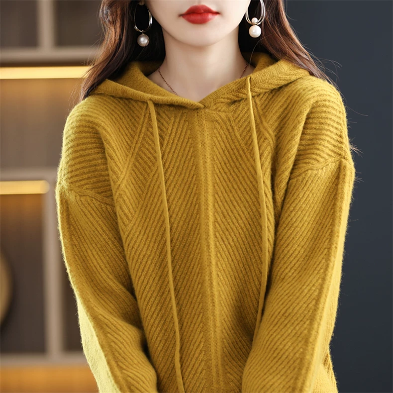 Hooded knit pullover with diagonal ribs and cable sections · QH-100