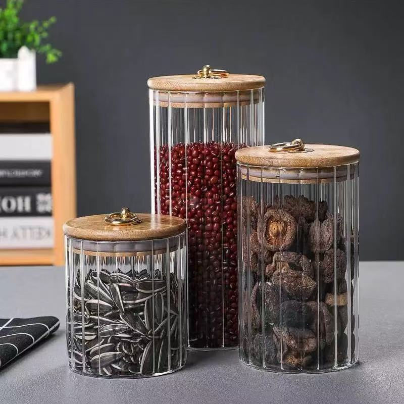 Ribbed glass storage jar with ring-handle lid · HJ-059