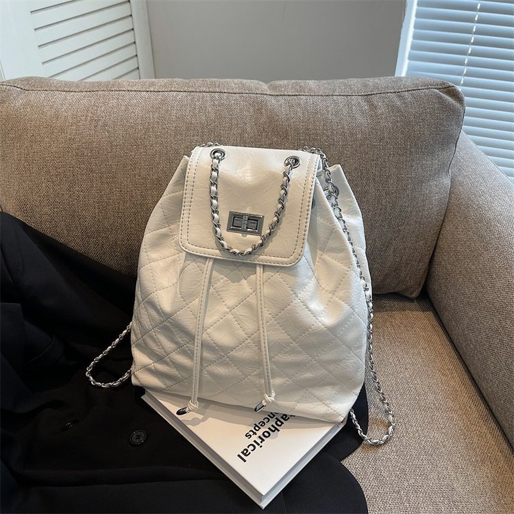 Quilted flap backpack with chain trim · BG-072