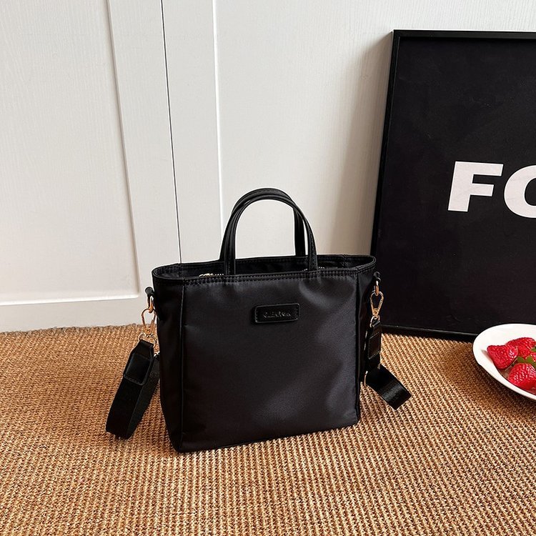 Upright twin-handle bag with side fastening tabs · BG-056