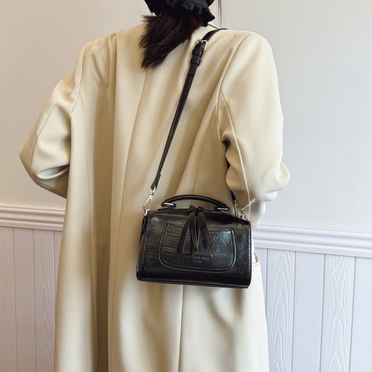 Embossed handbag with vertical decorative straps · BG-033