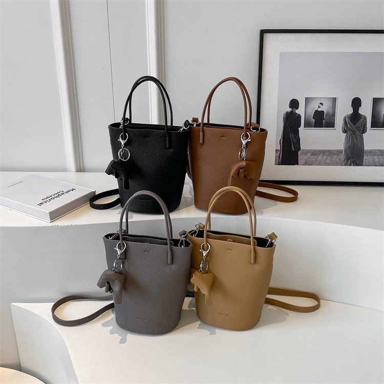 Cylindrical twin-handle crossbody bag · BG-068