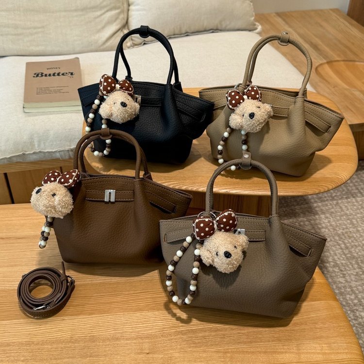 Wing-sided handbag with horizontal front strap · BG-036