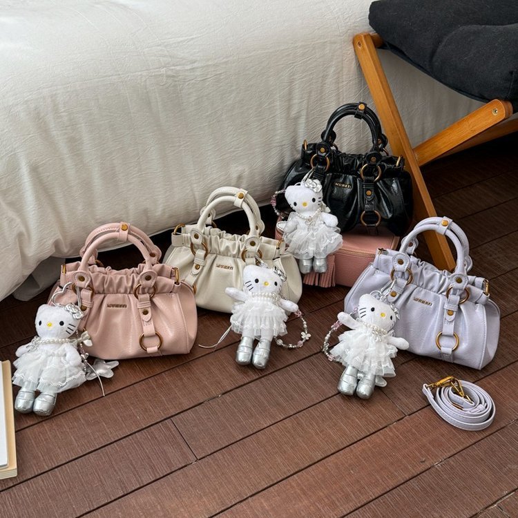Gathered handbag with ring-mounted twin handles · BG-039