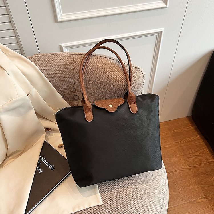 Fabric tote with small closure flap and twin handles · BG-051